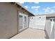 Private deck with double doors leading into the living space and a white privacy screen at 8367 S Reed St # A3, Littleton, CO 80128