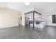 Spacious open floorplan living space connected to a stylish kitchen with breakfast bar at 8367 S Reed St # A3, Littleton, CO 80128