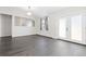 Bright living room provides access to the outside and features modern lighting at 8367 S Reed St # A3, Littleton, CO 80128