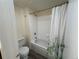 Bathroom with shower and tub combination and white tiling at 9995 E Harvard Ave # 261, Denver, CO 80231