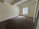 Bedroom with carpet, light walls, closet, and window view at 9995 E Harvard Ave # 261, Denver, CO 80231