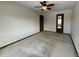 Empty bedroom with neutral walls, ceiling fan, and two doors for convenience at 1170 W 135Th Dr, Denver, CO 80234