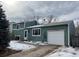 Split-level home featuring an attached one-car garage and charming curb appeal at 1170 W 135Th Dr, Denver, CO 80234