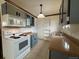 View of the kitchen featuring tiled floors and updated cabinets and countertops at 1170 W 135Th Dr, Denver, CO 80234