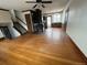 An open-concept living space with hardwood floors and a staircase on the left at 1170 W 135Th Dr, Denver, CO 80234