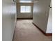 View of an unfinished room with a carpeted floor and a window for natural light at 1170 W 135Th Dr, Denver, CO 80234