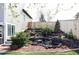 Landscaped backyard with a water feature provides a tranquil outdoor retreat at 9257 Shadowglen Ct, Highlands Ranch, CO 80126