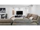 Finished basement with a large TV and comfortable seating create a cozy media space at 9257 Shadowglen Ct, Highlands Ranch, CO 80126