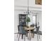 Elegant dining room with stylish chairs, modern chandelier, and sophisticated decor at 9257 Shadowglen Ct, Highlands Ranch, CO 80126