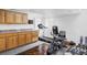 Well-equipped exercise room with treadmill, bike, and storage creates a private gym at 9257 Shadowglen Ct, Highlands Ranch, CO 80126