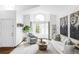 Inviting living room with large window, comfortable seating, and decorative accents at 9257 Shadowglen Ct, Highlands Ranch, CO 80126