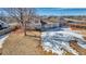 Spacious backyard, partially covered in snow, with mountain views at 1912 S Truckee St, Aurora, CO 80013