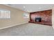 Basement recreation room with brick fireplace at 1912 S Truckee St, Aurora, CO 80013