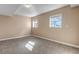 Spacious finished basement bedroom with neutral carpeting and large windows at 1912 S Truckee St, Aurora, CO 80013