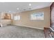 Finished basement with carpet and windows at 1912 S Truckee St, Aurora, CO 80013