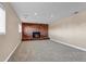 Basement recreation room with brick fireplace at 1912 S Truckee St, Aurora, CO 80013