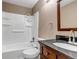 Bathroom with tub, shower, vanity, and toilet at 1912 S Truckee St, Aurora, CO 80013