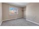 Simple bedroom with carpet, window, and closet at 1912 S Truckee St, Aurora, CO 80013