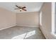 Well-lit bedroom with neutral walls and carpet flooring at 1912 S Truckee St, Aurora, CO 80013