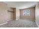 Bedroom with neutral walls, carpet, and window at 1912 S Truckee St, Aurora, CO 80013