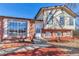 House exterior showcasing brick and light-colored siding, and a two-car garage at 1912 S Truckee St, Aurora, CO 80013