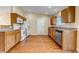 Kitchen with wood cabinets and a door to outside at 1912 S Truckee St, Aurora, CO 80013