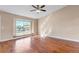 Spacious living room with hardwood floors, a large window, and ceiling fan at 1912 S Truckee St, Aurora, CO 80013