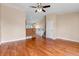 Bright living room with hardwood floors and staircase at 1912 S Truckee St, Aurora, CO 80013