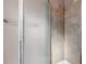 Shower stall with tiled walls and glass door at 1912 S Truckee St, Aurora, CO 80013