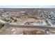 Aerial view of community showing open green space and a road at 9489 Ashbury Cir # 202, Parker, CO 80134