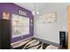 Bright dining area with purple accent wall and decorative rug at 9489 Ashbury Cir # 202, Parker, CO 80134