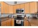 Kitchen features stainless steel appliances and granite countertops at 9489 Ashbury Cir # 202, Parker, CO 80134