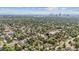An aerial view of the neighborhood with tree-lined streets and the Denver skyline in the background at 3429 N Adams St, Denver, CO 80205
