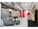 Finished basement area featuring a seating area, red accents, and ample space at 3429 N Adams St, Denver, CO 80205