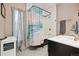 Bright bathroom featuring a shower/tub with decorative curtain, vanity, and neutral color palette at 3429 N Adams St, Denver, CO 80205