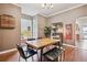 Stylish dining area featuring wood table, seating, shelving, and contemporary decor at 3429 N Adams St, Denver, CO 80205