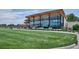 The exterior of a building with floor to ceiling windows on well manicured green lawns at 3429 N Adams St, Denver, CO 80205
