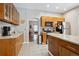 Open kitchen featuring granite countertops, stainless steel appliances, and wood cabinetry at 3429 N Adams St, Denver, CO 80205