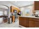 Well-lit kitchen with stainless steel appliances, granite countertops, and wood cabinetry at 3429 N Adams St, Denver, CO 80205