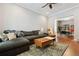 Cozy living room with plush sofa, stylish coffee table, and ceiling fan at 3429 N Adams St, Denver, CO 80205