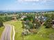 Aerial view of neighborhood with well-maintained lawns and city skyline at 15895 W Bayaud Dr, Golden, CO 80401