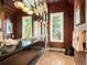 Modern bathroom featuring double vanity, beautiful mirrored wall, and abundant lighting at 15895 W Bayaud Dr, Golden, CO 80401