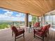 Spacious covered deck featuring comfortable seating and scenic views at 15895 W Bayaud Dr, Golden, CO 80401