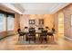 Formal dining room showcasing hardwood floors, decorative walls, recessed lighting, and ample natural light at 15895 W Bayaud Dr, Golden, CO 80401