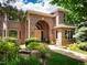 Brick house with landscaping and an arched entryway at 15895 W Bayaud Dr, Golden, CO 80401