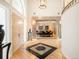 Eye-catching foyer featuring hardwood floors, unique tile accents, and a view into the formal dining room at 15895 W Bayaud Dr, Golden, CO 80401