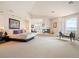 This main bedroom features a fireplace, lounge area, and expansive windows with mountain views at 15895 W Bayaud Dr, Golden, CO 80401