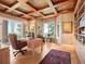 Bright office with custom coffered ceiling, built-in bookshelves, and scenic views at 15895 W Bayaud Dr, Golden, CO 80401