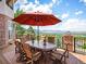 Outdoor patio dining area with mountain views, perfect for entertaining guests at 15895 W Bayaud Dr, Golden, CO 80401