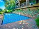 Backyard pool with stone wall and lush landscaping at 15895 W Bayaud Dr, Golden, CO 80401